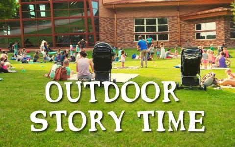 photo of participants enjoying outdoor story time at the library