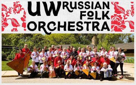 the UW Russian Folk Orchestra posing as a group outside with instruments and authentic costumes