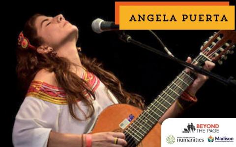Angela Puerta playing guitar on stage