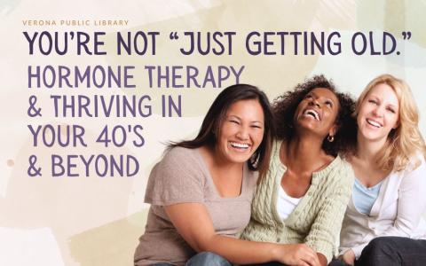 Three smiling women in their 40's.