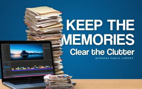 large stack of documents, a stack of photos, and a laptop with photo editing software open