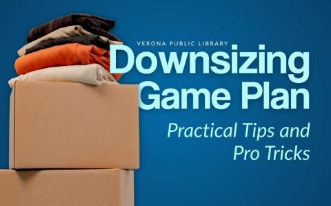 cardboard boxes stacked on top of each other with folded clothes on top against a dark blue background