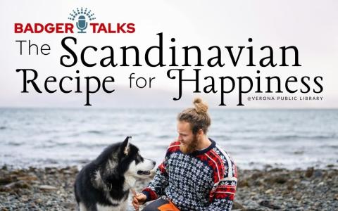 photo of a man with his dog smiling on a Scandinavian ocean coast.