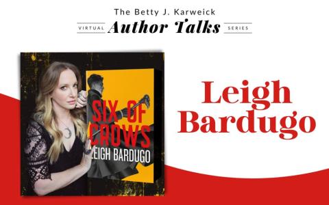 author Leigh Bardugo next to a copy of her book, "Six of Crows".