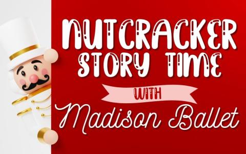 a nutcracker with a white and gold suit holding a red banner