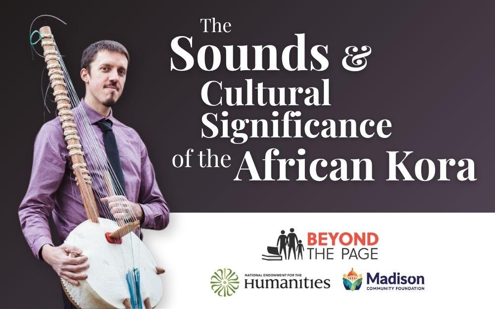 photo of a man in a dress shirt and tie holding an African kora stringed instrument