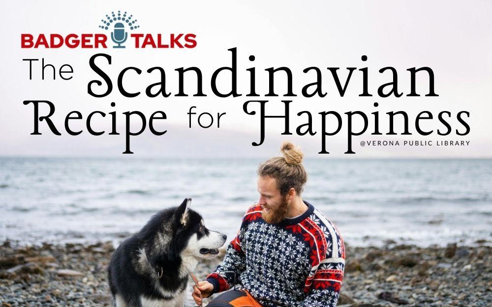 photo of a man with his dog smiling on a Scandinavian ocean coast.